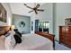 Well-lit main bedroom with natural lighting and sliding glass doors to the outside at 2376 Park Village Pl, Apopka, FL 32712