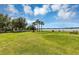 Lakeside playground with grassy area at 2376 Park Village Pl, Apopka, FL 32712