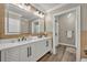 Elegant bathroom with double vanity and herringbone design at 239 Longview Ave # 216, Celebration, FL 34747