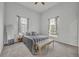 Spacious bedroom with striped bedding and a bench at the foot of the bed at 239 Longview Ave # 216, Celebration, FL 34747