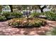 Charming courtyard with a central fountain surrounded by lush flowers at 239 Longview Ave # 216, Celebration, FL 34747