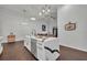 Modern kitchen with white cabinets, marble countertops, and stainless steel appliances at 239 Longview Ave # 216, Celebration, FL 34747