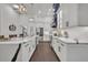 Modern kitchen with white cabinets, quartz countertops, and a large island at 239 Longview Ave # 216, Celebration, FL 34747