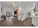 Open concept kitchen with island, stainless steel appliances, and dark hardwood floors at 239 Longview Ave # 216, Celebration, FL 34747