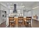 Modern kitchen with white cabinets, quartz countertops and a statement range hood at 239 Longview Ave # 216, Celebration, FL 34747