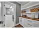 Laundry room with white cabinets, wood countertop, and patterned tile floor at 239 Longview Ave # 216, Celebration, FL 34747
