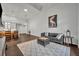 Spacious living room with gray sectional sofa and kitchen view at 239 Longview Ave # 216, Celebration, FL 34747