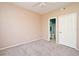 Bedroom featuring neutral carpet, ceiling fan, and an ensuite bathroom at 2572 Robert Trent Jones Dr # 1231, Orlando, FL 32835