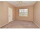 Bedroom with neutral carpet, ceiling fan, and a bright window for natural light at 2572 Robert Trent Jones Dr # 1231, Orlando, FL 32835