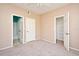 Bedroom with carpet, ceiling fan, and en-suite bathroom at 2572 Robert Trent Jones Dr # 1231, Orlando, FL 32835