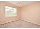 Bedroom with neutral carpet and a bright window at 2572 Robert Trent Jones Dr # 1231, Orlando, FL 32835