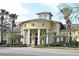 Community clubhouse with columns and a circular design at 2572 Robert Trent Jones Dr # 1231, Orlando, FL 32835