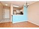 Dining area with hardwood floors and kitchen passthrough at 2572 Robert Trent Jones Dr # 1231, Orlando, FL 32835