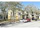 Exterior view of a two-story condo building with ample parking at 2572 Robert Trent Jones Dr # 1231, Orlando, FL 32835