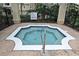 Community hot tub with a surrounding fence and a no diving sign at 2572 Robert Trent Jones Dr # 1231, Orlando, FL 32835
