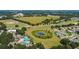 An aerial shot of the community, revealing the lush green golf course and pool at 26812 Augusta Springs Cir, Leesburg, FL 34748