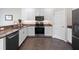 Beautiful kitchen features stainless steel appliances, granite countertops, and plenty of cabinet space at 26812 Augusta Springs Cir, Leesburg, FL 34748