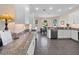 Well-equipped kitchen featuring granite countertops, stainless steel appliances, and white cabinets at 26812 Augusta Springs Cir, Leesburg, FL 34748