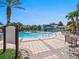 Large community pool with ample seating and a clubhouse, perfect for leisure and recreation at 26812 Augusta Springs Cir, Leesburg, FL 34748