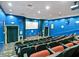 Community theater boasts comfortable seating, and a large movie screen at 26812 Augusta Springs Cir, Leesburg, FL 34748