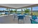 Covered patio area with tables and chairs near the pool at 2769 Flushing Dr, Apopka, FL 32703
