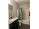 Bathroom includes a tub shower combo and granite vanity at 3017 Cottage Grove Ct # Ge, Orlando, FL 32822