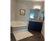 Bathroom boasts a corner jacuzzi tub and granite countertop at 3017 Cottage Grove Ct # Ge, Orlando, FL 32822