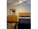 Bright bedroom with wood flooring and a full-size bed at 3017 Cottage Grove Ct # Ge, Orlando, FL 32822