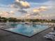 Relaxing community pool with plenty of lounge chairs at 3017 Cottage Grove Ct # Ge, Orlando, FL 32822
