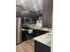 Modern kitchen featuring dark cabinetry and granite countertops at 3017 Cottage Grove Ct # Ge, Orlando, FL 32822