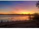 Stunning sunset over a tranquil lake, creating a serene and picturesque view at 3017 Cottage Grove Ct # Ge, Orlando, FL 32822