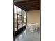 Enjoy relaxing on this screened patio, featuring a table and chairs at 3017 Cottage Grove Ct # Ge, Orlando, FL 32822
