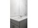 Bright bathroom features a modern vanity with white countertop and gray cabinetry at 307 River Front Way, Edgewater, FL 32141