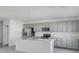 Modern kitchen with stainless steel appliances and grey cabinets at 307 River Front Way, Edgewater, FL 32141