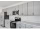 Spacious kitchen featuring stainless steel appliances and quartz countertops at 307 River Front Way, Edgewater, FL 32141