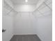 Empty walk-in closet with wire shelving and carpeted floor at 307 River Front Way, Edgewater, FL 32141