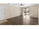 Living room with hardwood floors and access to a balcony at 314 Cherokee Ct # G, Altamonte Springs, FL 32701