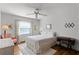 Cozy bedroom featuring hardwood floors and a vintage sewing machine at 3158 Whisper Wind Dr, Saint Cloud, FL 34771