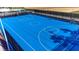 Full-size outdoor basketball court with blue surface at 3937 Lana Ave, Davenport, FL 33897