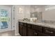 Double vanity bathroom with granite countertops and shower at 3937 Lana Ave, Davenport, FL 33897