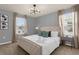 Spacious Primary bedroom with tufted headboard and neutral decor at 3937 Lana Ave, Davenport, FL 33897