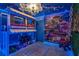 Encanto themed bedroom with bunk beds and mural at 3937 Lana Ave, Davenport, FL 33897