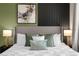 King bed, stylish pillows and neutral color palette at 3937 Lana Ave, Davenport, FL 33897