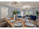 Bright dining room features a large wooden table with seating for eight at 3937 Lana Ave, Davenport, FL 33897