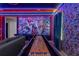 Superhero themed game room with shuffleboard and mural at 3937 Lana Ave, Davenport, FL 33897