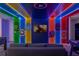 Superhero themed game room with LED lighting and multiple games at 3937 Lana Ave, Davenport, FL 33897