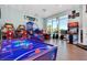 Fun game room with air hockey, arcade games, and basketball at 3937 Lana Ave, Davenport, FL 33897