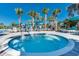 Relaxing hot tub surrounded by palm trees and seating at 3937 Lana Ave, Davenport, FL 33897