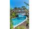 Relaxing lazy river winding through a tropical landscape at 3937 Lana Ave, Davenport, FL 33897