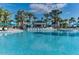 Relaxing pool area with swim-up bar and lounge chairs at 3937 Lana Ave, Davenport, FL 33897